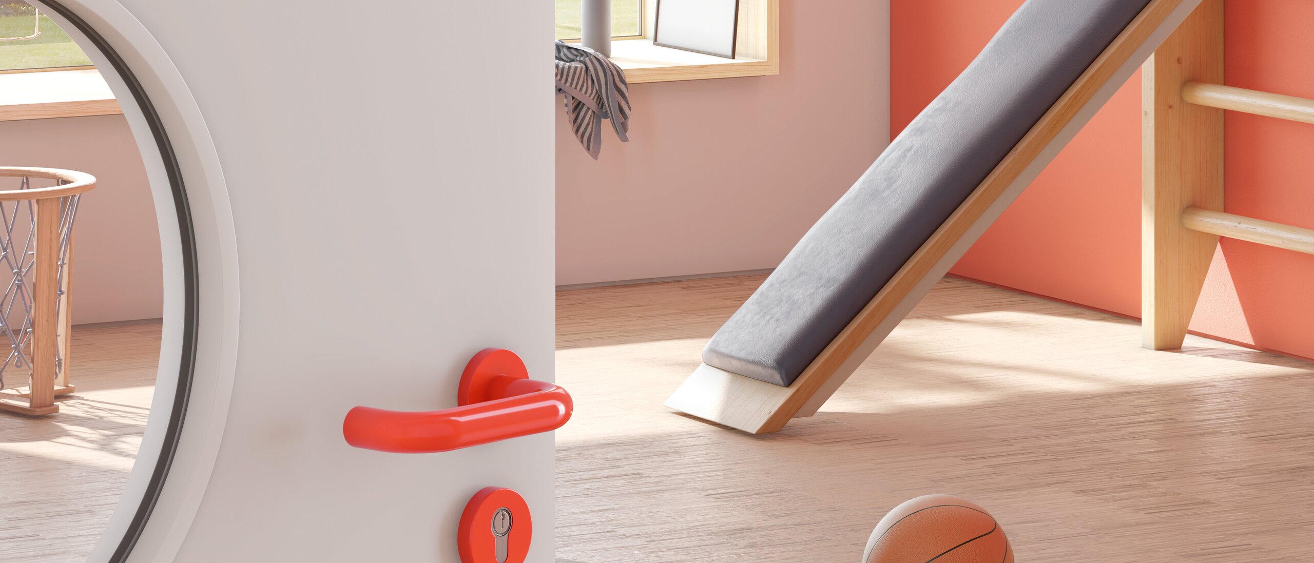 Door to a sports room of a kindergarten equipped with a lever handle in the colour orange made of polyamide